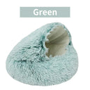 Green plush pet bed with removable cover for cats and small dogs, designed as a warm round sleeping nest.