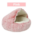 Pink plush round pet bed with removable cover, ideal for cats and small dogs, offering warmth and comfort.