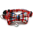 Festive red plaid pet collar with snowflake bowknot and jingling bell, featuring adjustable breakaway safety buckle.